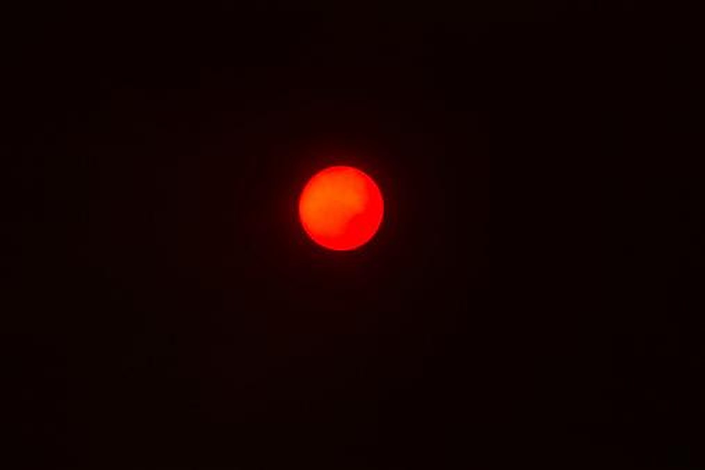 A glowing red sun